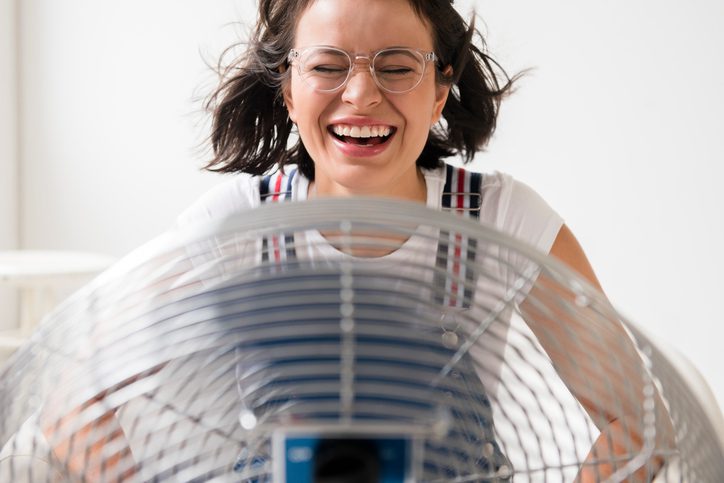 American Air Heating & Cooling | Rock Hill, SC | woman cooling off with fan